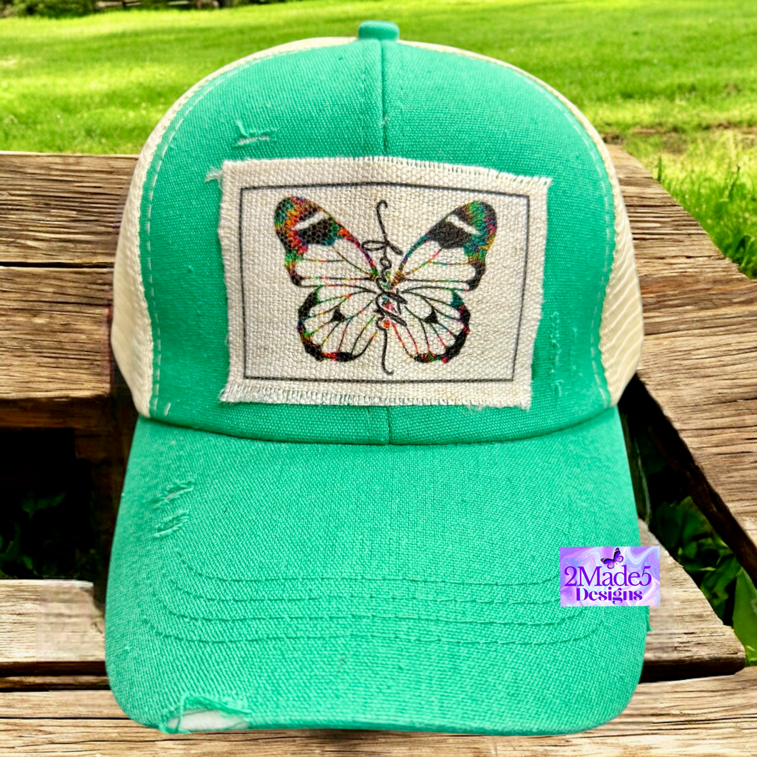Faith Butterfly Green Distressed Criss Cross Ponytail Hat