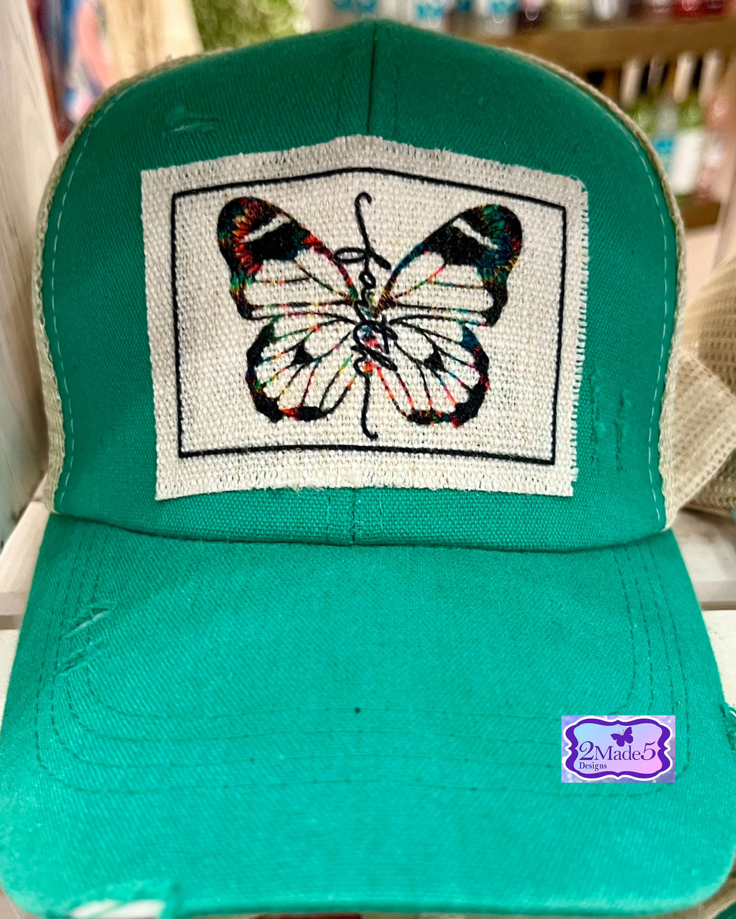 Faith Butterfly Green Distressed Criss Cross Ponytail Hat