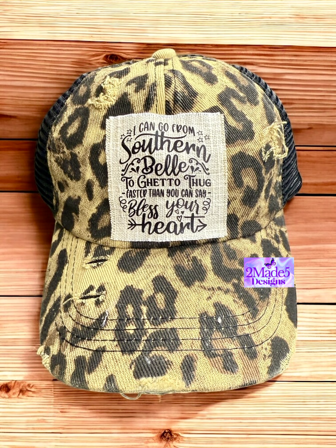 I Can Go From Southern Belle To Ghetto Thug Faster Than You Can Say Bless Your Heart Distressed Leopard Criss Cross Ponytail Hat