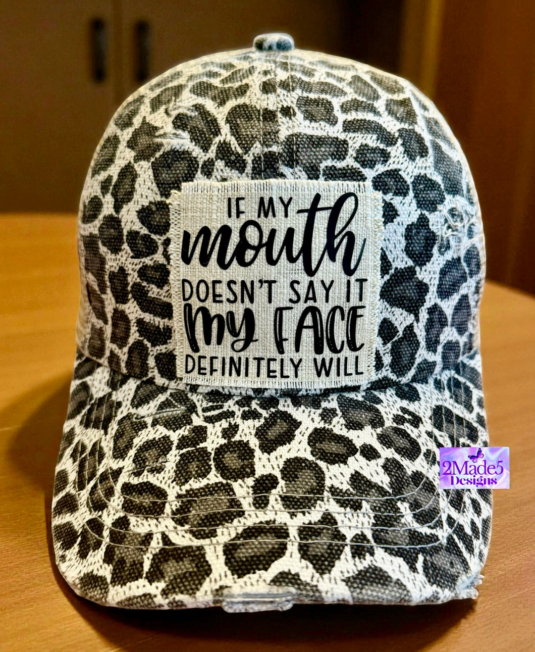 If My Mouth Doesn’t Say It My Face Definitely Will Distressed white cheetah Criss Cross Ponytail Hat