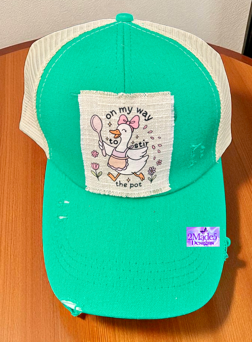 On My Way To Stir The Pot Distressed Criss Cross Ponytail Hat