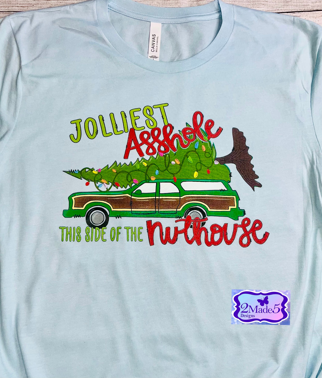 Jolliest A*shole This Side Of The Nuthouse on Bella Canvas Heather Ice Blue Shirt