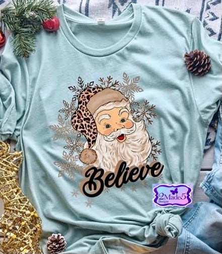 Believe Leopard Santa on Bella Canvas Heather Ice Blue Shirt