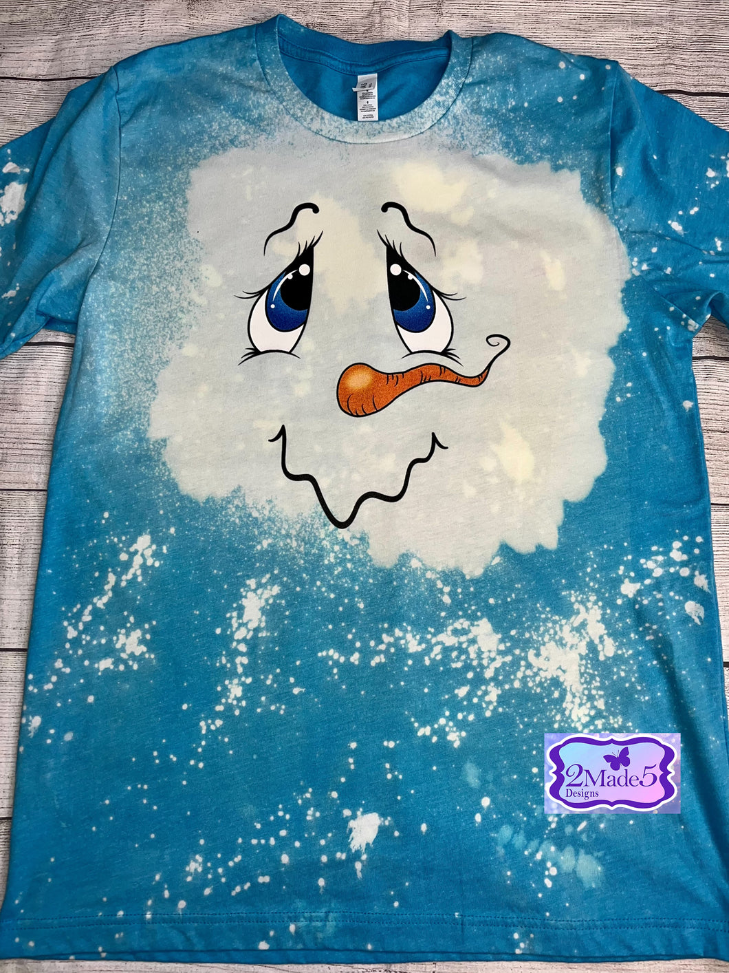 Melting Snowman Face on Bella Canvas Bleached Aqua Shirt